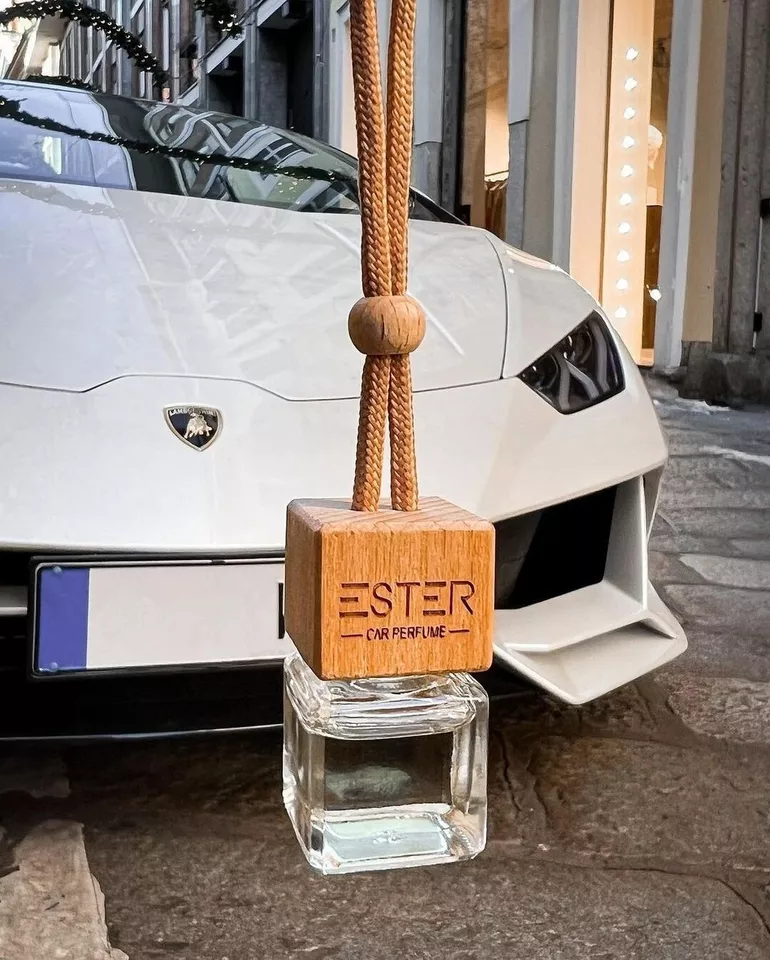 Premium Car Fragrance with Aromatherapy Containing Refined Scents with a rope near a Lamborghini 